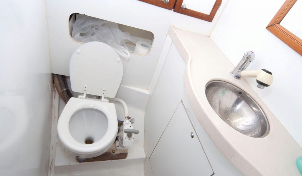 Latrine and shower on sailing boat with toilet paper
