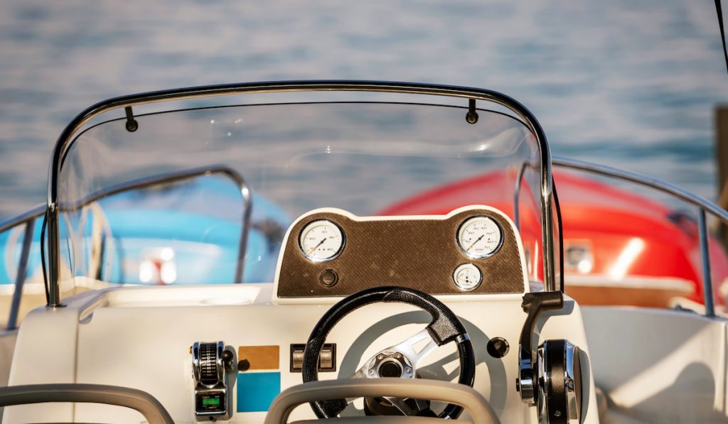 Motorboats front console with measuring instruments. Close-up photograph of boat panel,