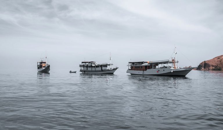 Sea-Boats-On-Misty-Ocean