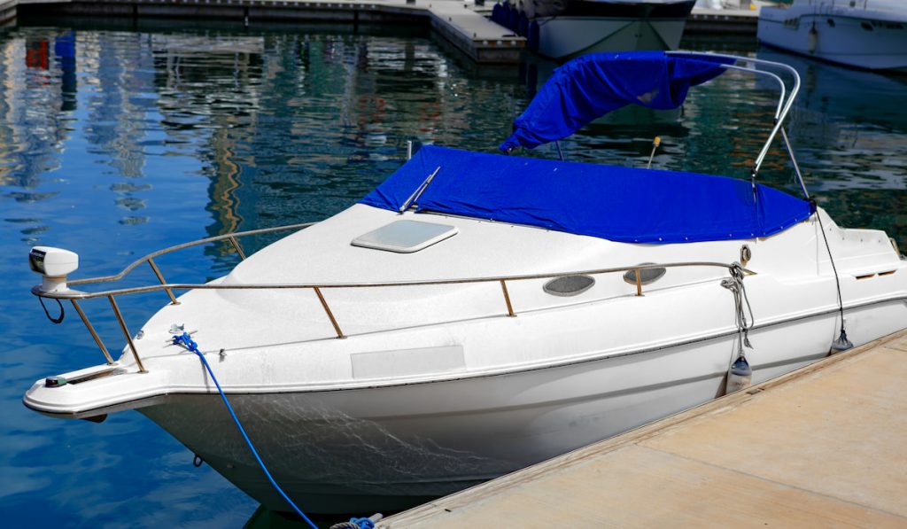 Small luxury motor boat parked at the pier
